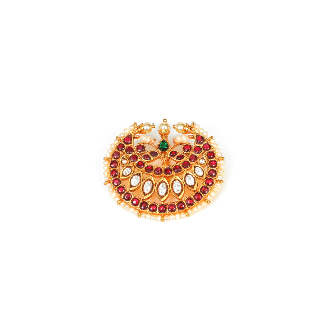 Rajwada Crescent: crescent-shaped ornament with red and clear stones, a green accent and pearl-style edging