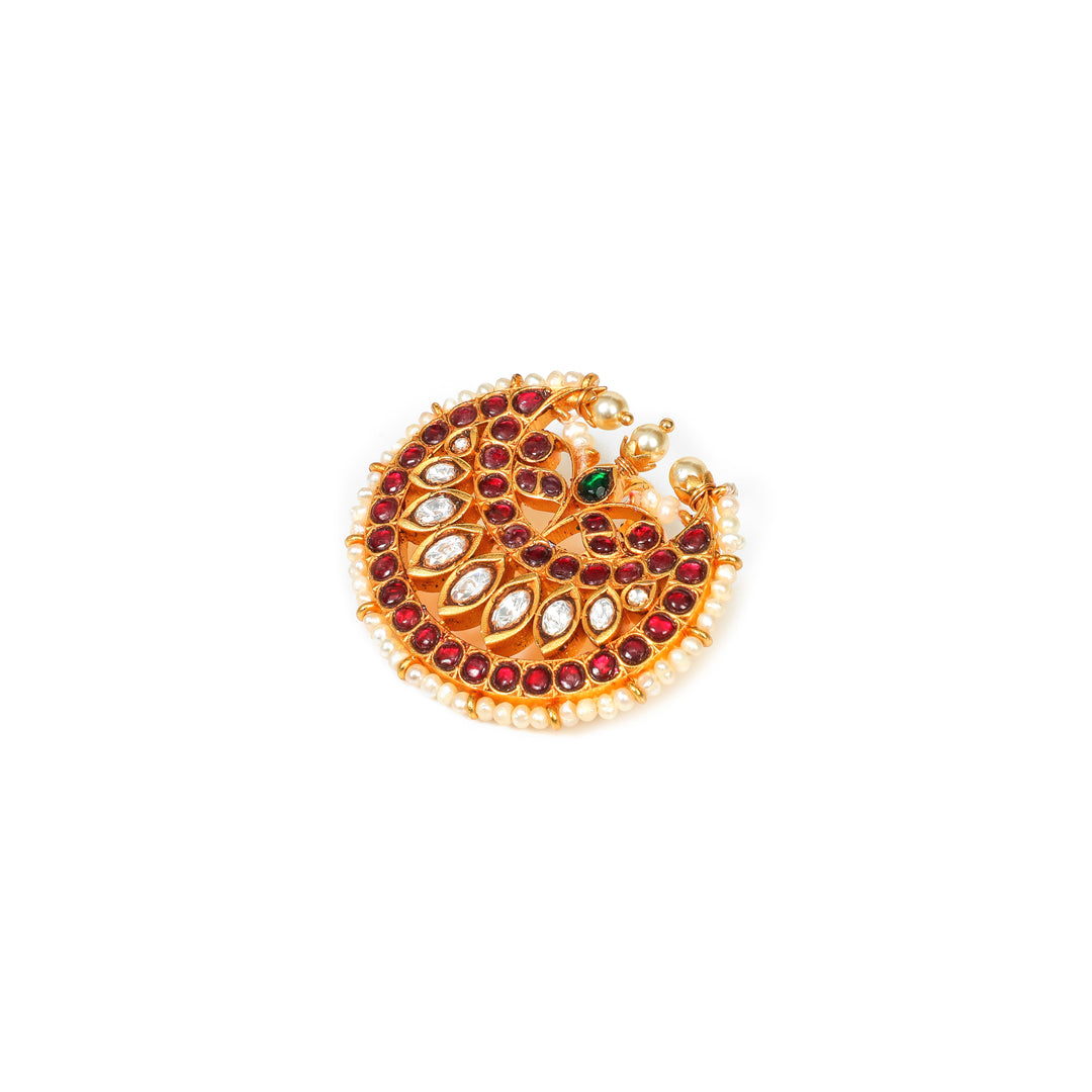 Rajwada Crescent: crescent-shaped ornament with red and clear stones, a green accent and pearl-style edging