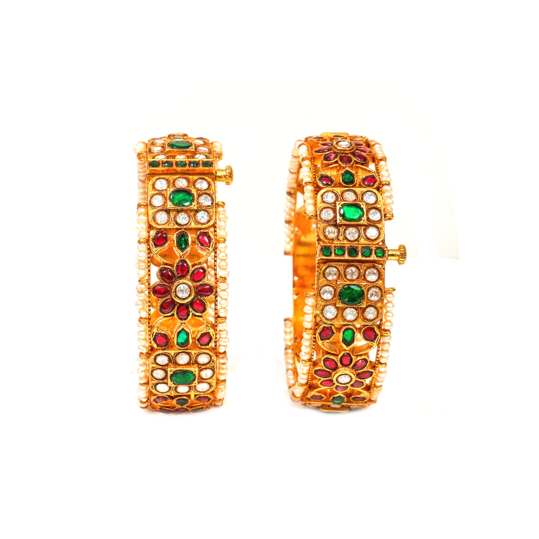 Rajputana Heritage: broad bangles with red and green accents, clear stone clusters, floral motifs and pearl-style edging