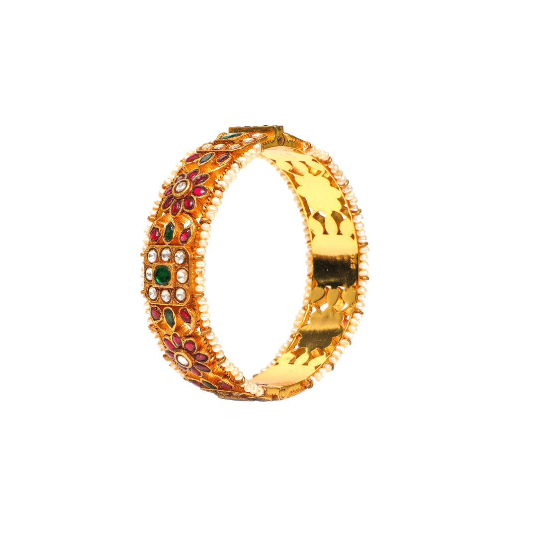 Rajputana Heritage: broad bangles with red and green accents, clear stone clusters, floral motifs and pearl-style edging