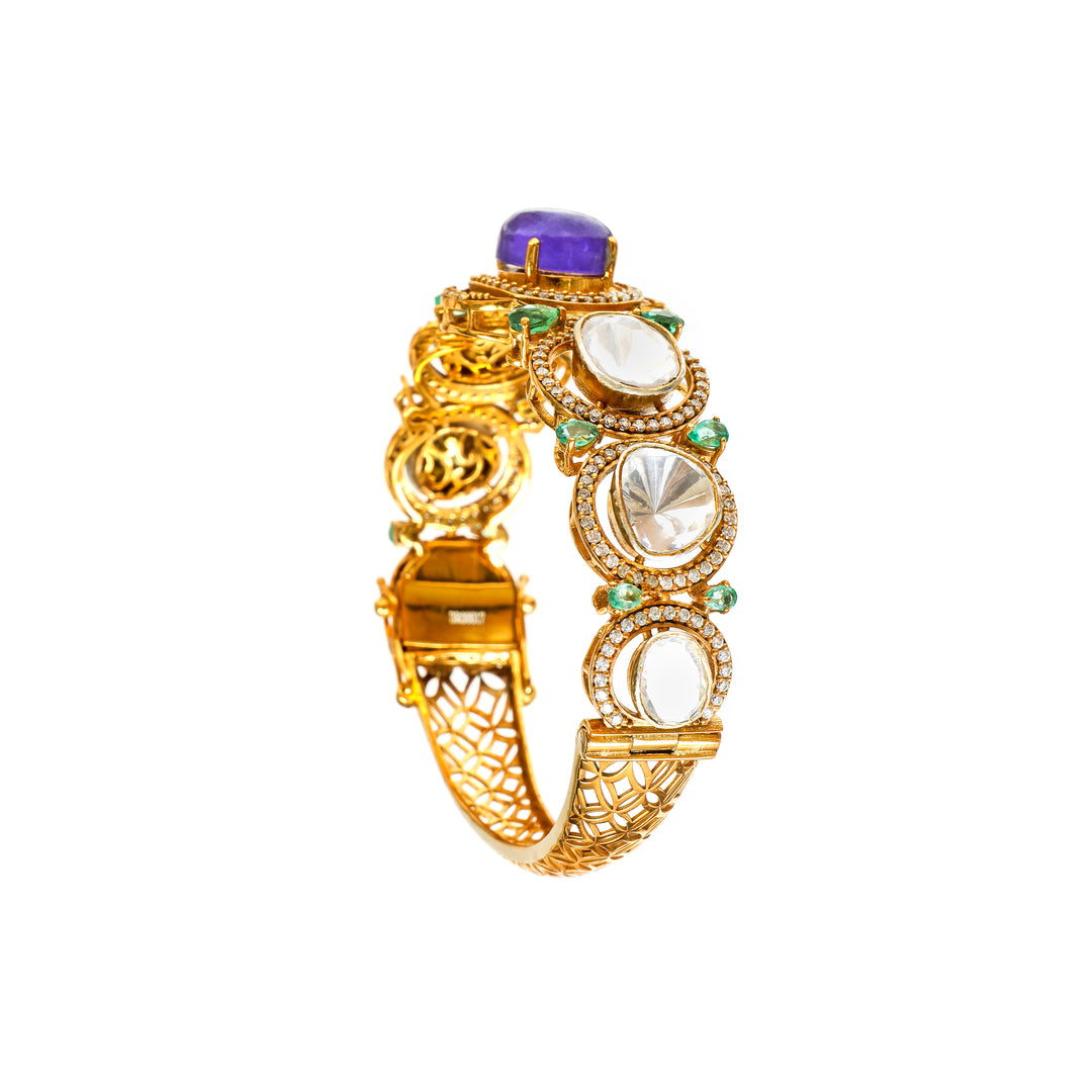 Meenakari Garden: ornate bracelet with green, purple and clear stone accents in a gold-tone setting