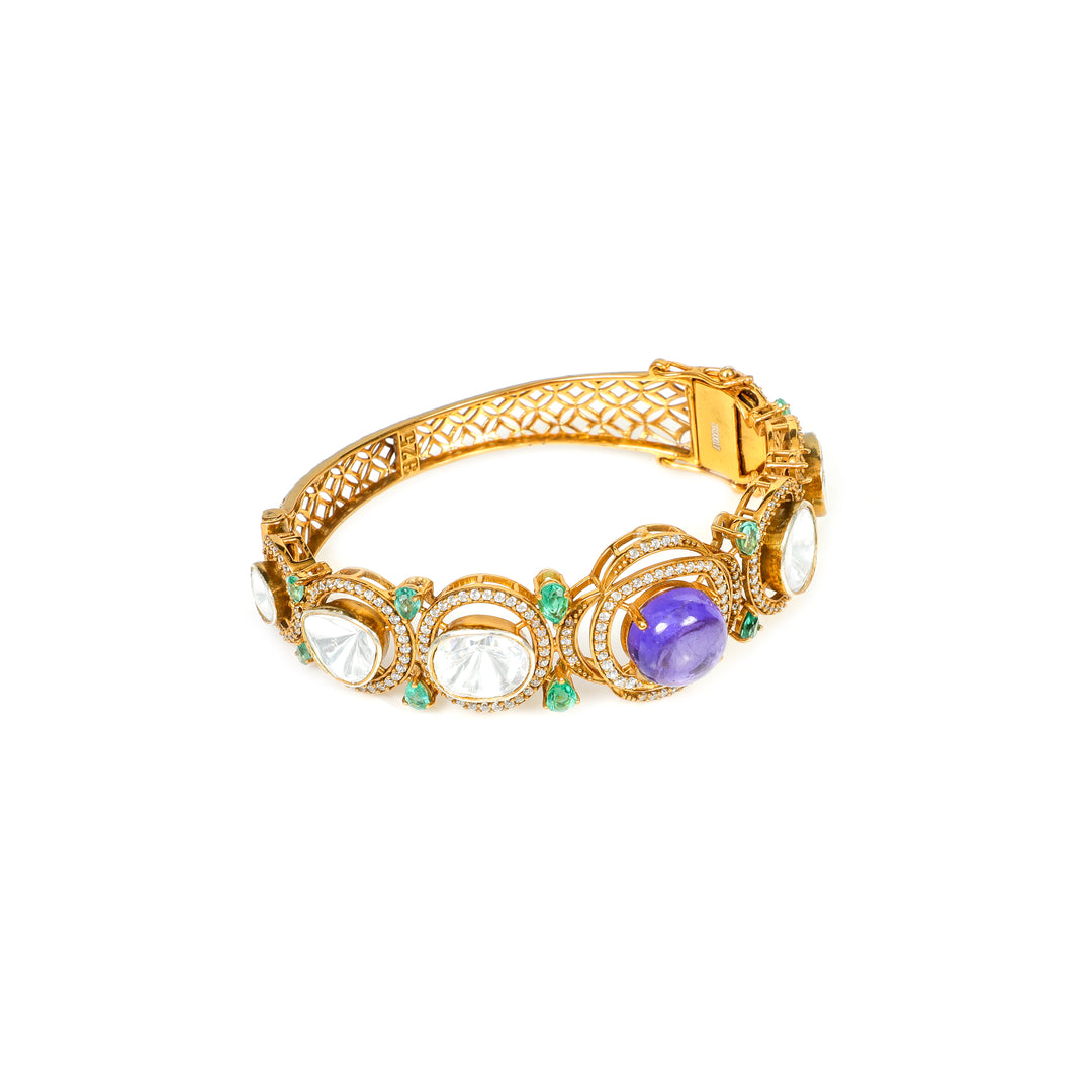 Meenakari Garden: ornate bracelet with green, purple and clear stone accents in a gold-tone setting