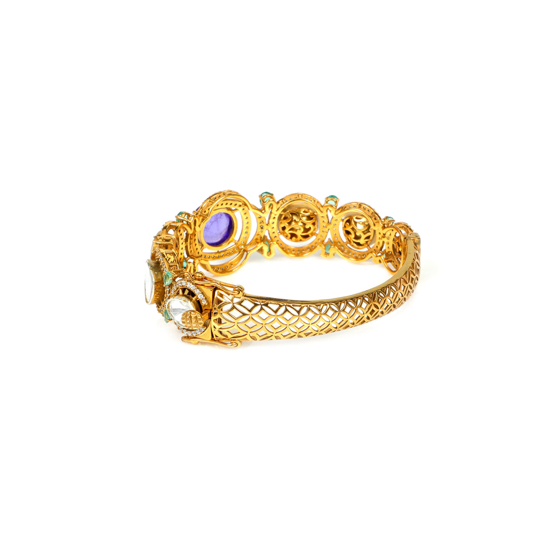 Meenakari Garden: ornate bracelet with green, purple and clear stone accents in a gold-tone setting