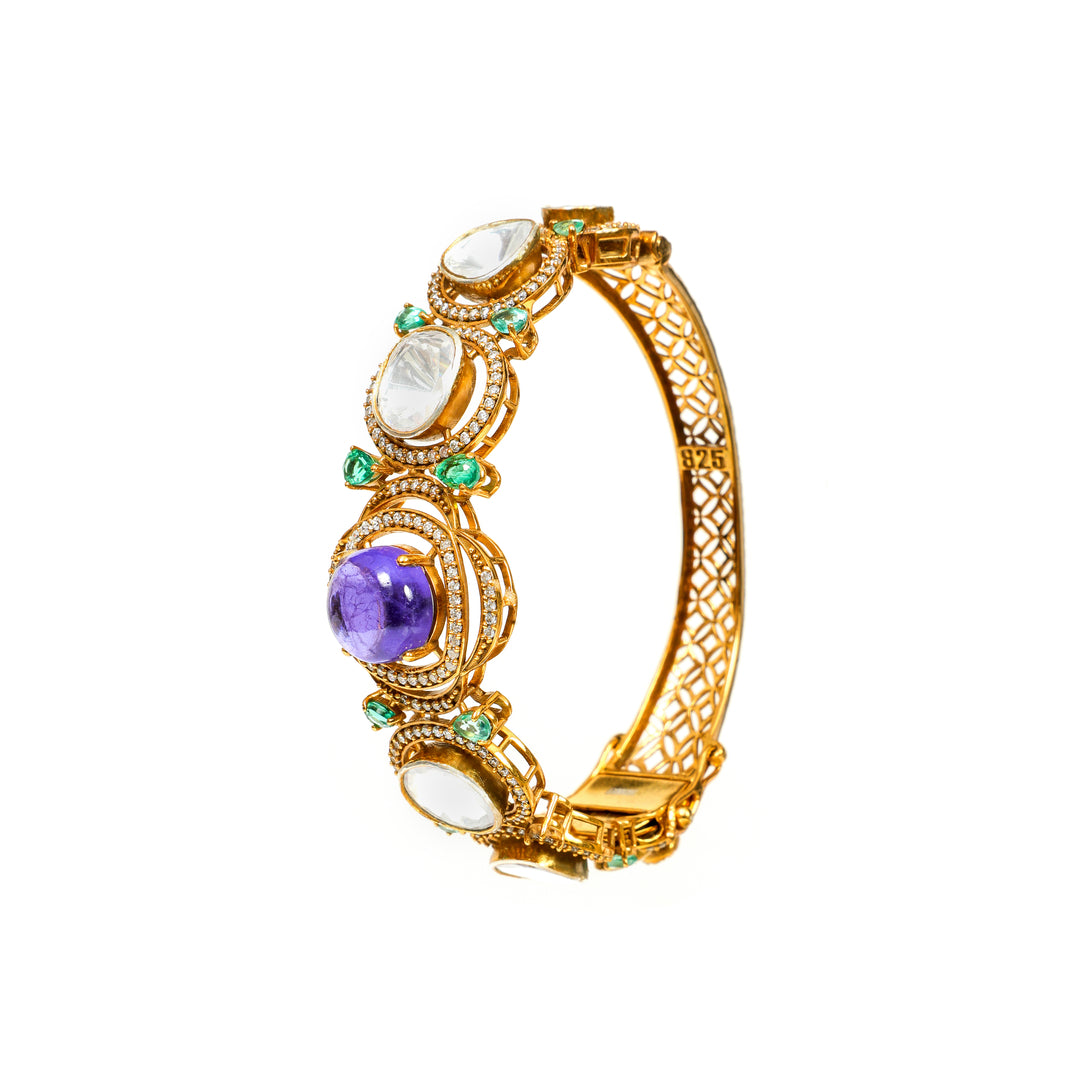 Meenakari Garden: ornate bracelet with green, purple and clear stone accents in a gold-tone setting