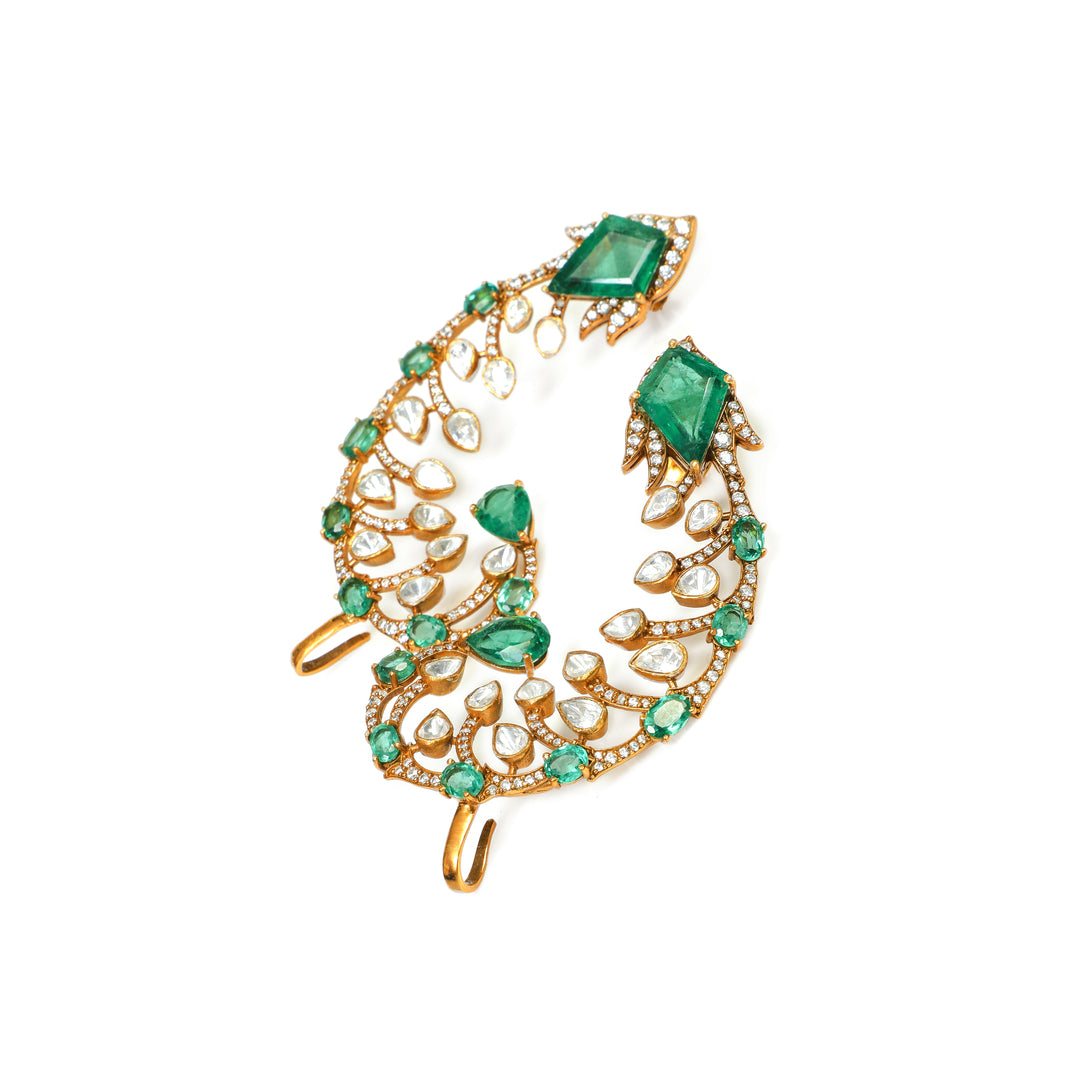 Emerald Feather: curved feather-inspired earrings with green and clear stone accents