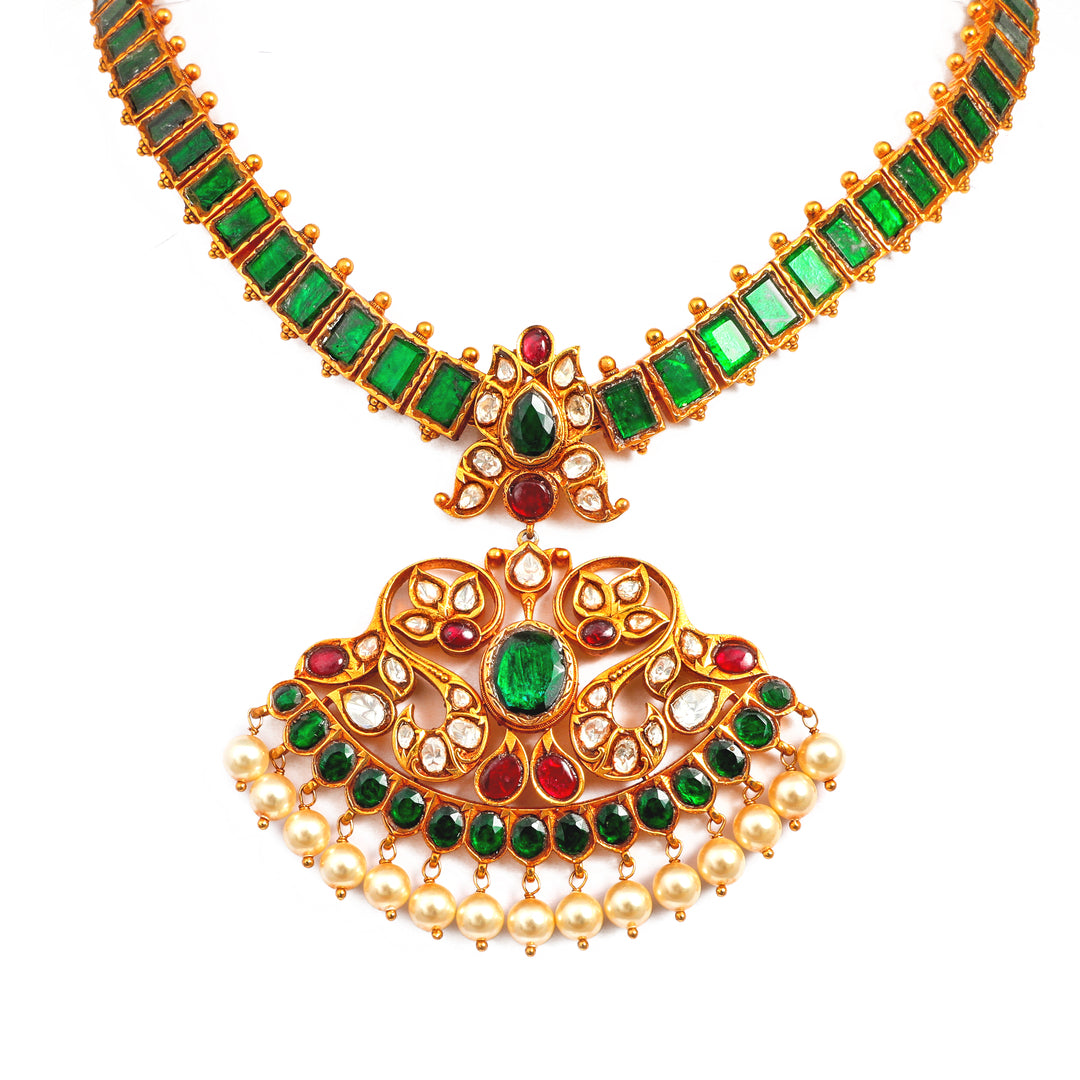 Emerald Pendant Mala: green-accented necklace with an ornate central pendant and fine beaded detailing