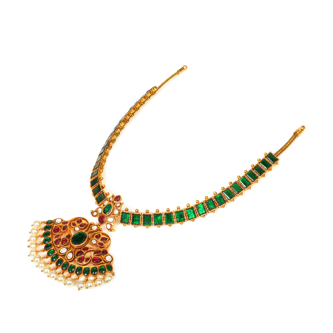 Emerald Pendant Mala: green-accented necklace with an ornate central pendant and fine beaded detailing