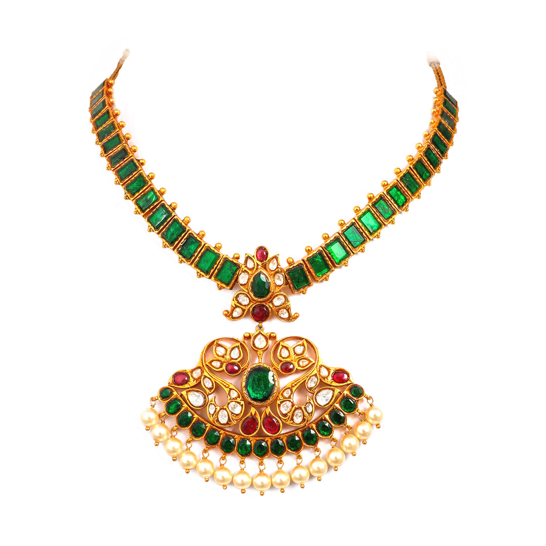 Emerald Pendant Mala: green-accented necklace with an ornate central pendant and fine beaded detailing