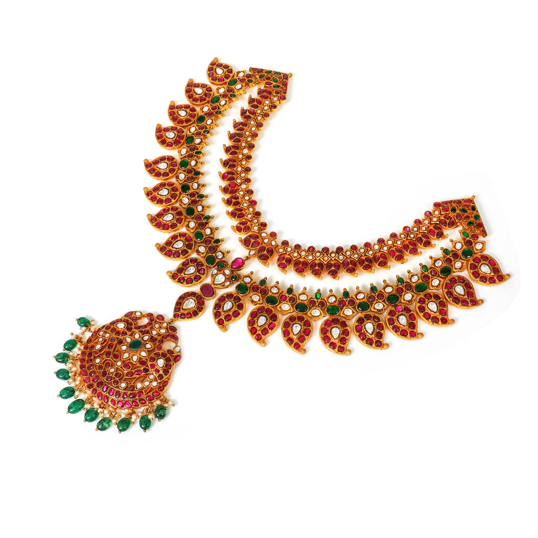 Padma Ruby Collar: curved collar necklace with red and green accents and a central circular pendant