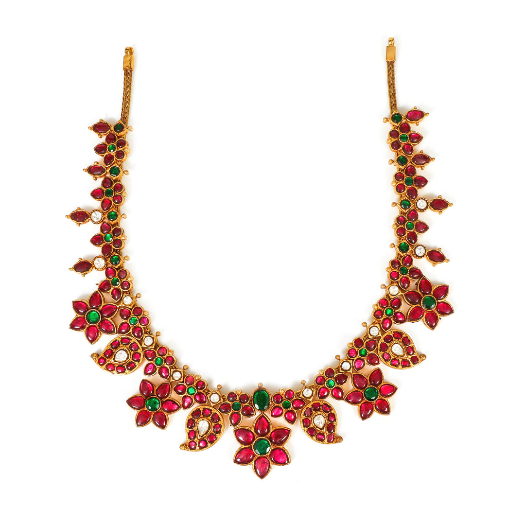 Gulabi Floral Collar: curved necklace with repeating red floral motifs and green accents