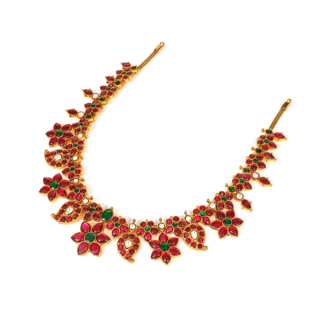 Gulabi Floral Collar: curved necklace with repeating red floral motifs and green accents