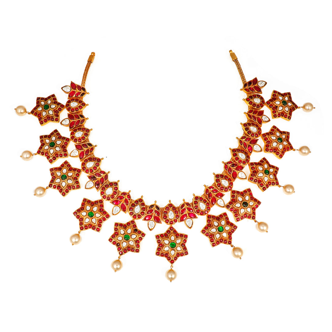 Starburst Heritage Necklace: statement necklace with repeating star motifs and red and green accents
