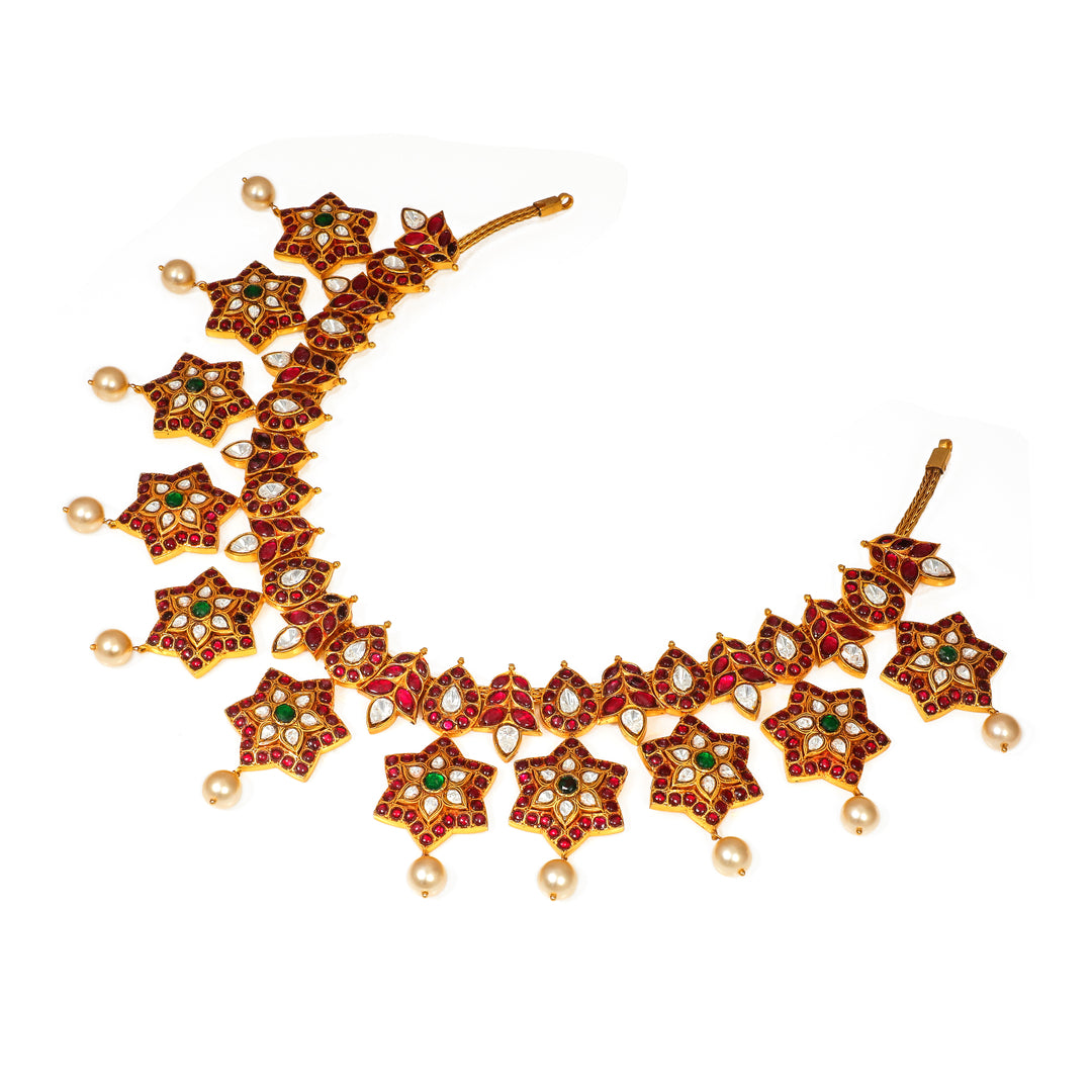 Starburst Heritage Necklace: statement necklace with repeating star motifs and red and green accents