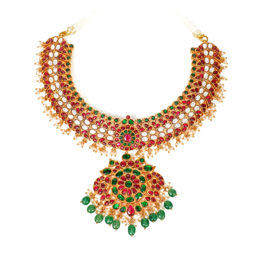 Rani Emerald Bridal Necklace: layered ornate necklace with a large central medallion and green and red accents