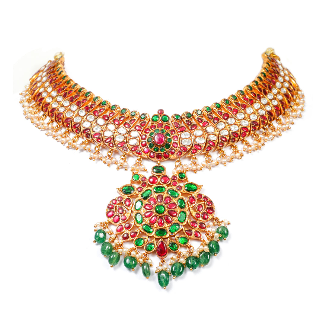 Rani Emerald Bridal Necklace: layered ornate necklace with a large central medallion and green and red accents