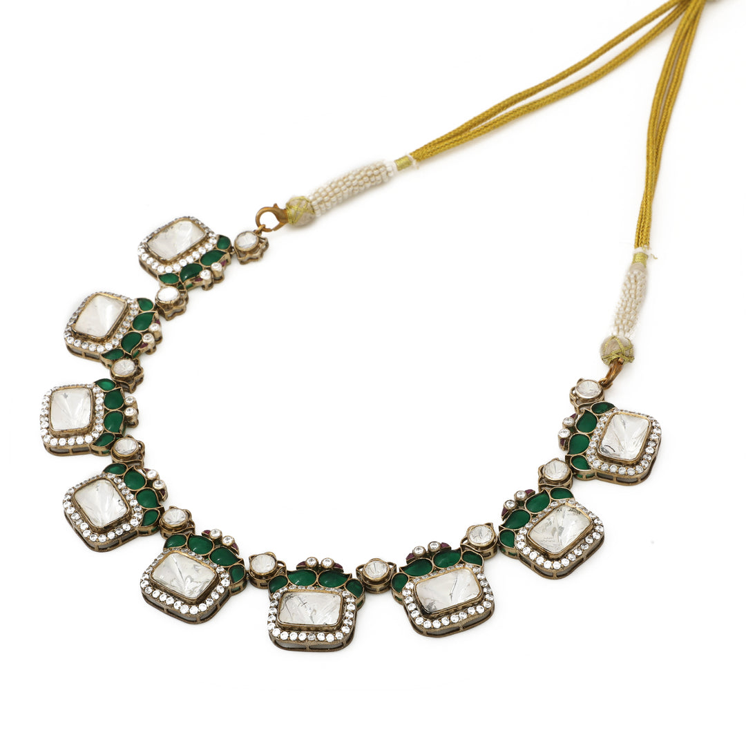 Emerald Geometric Collar: necklace with repeating square green-centred motifs framed by clear accents