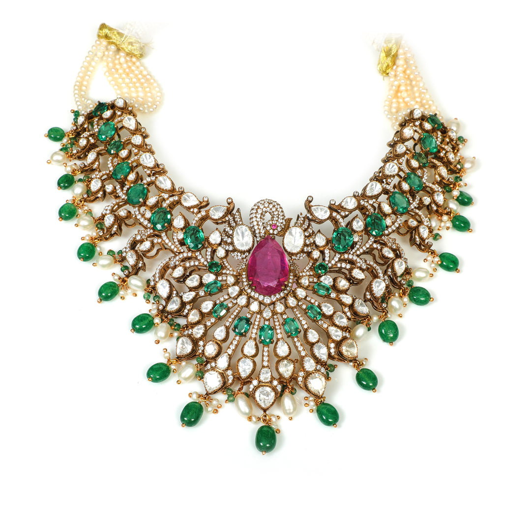 Emerald Rani Statement Necklace: ornate broad necklace with green accents, pink centre details and layered drop motifs