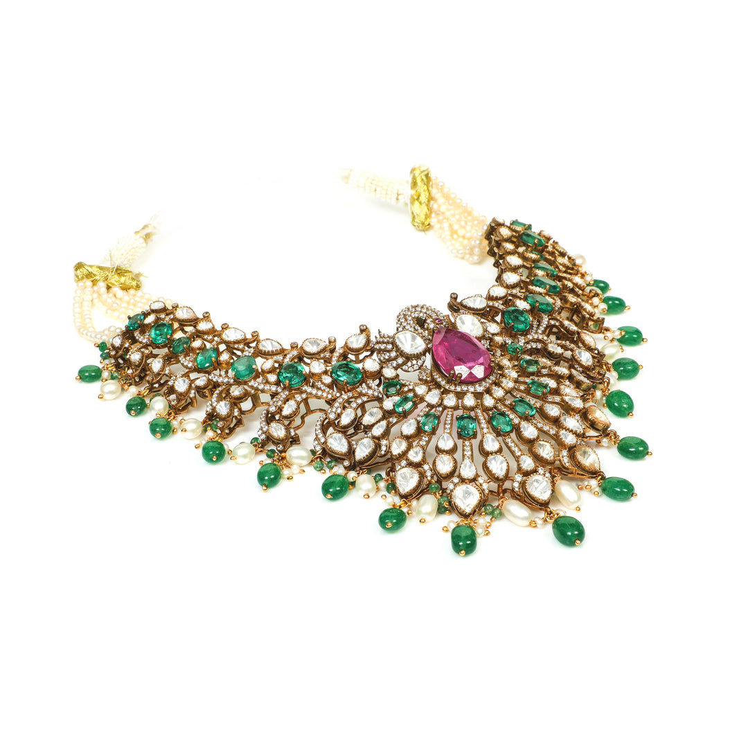 Emerald Rani Statement Necklace: ornate broad necklace with green accents, pink centre details and layered drop motifs